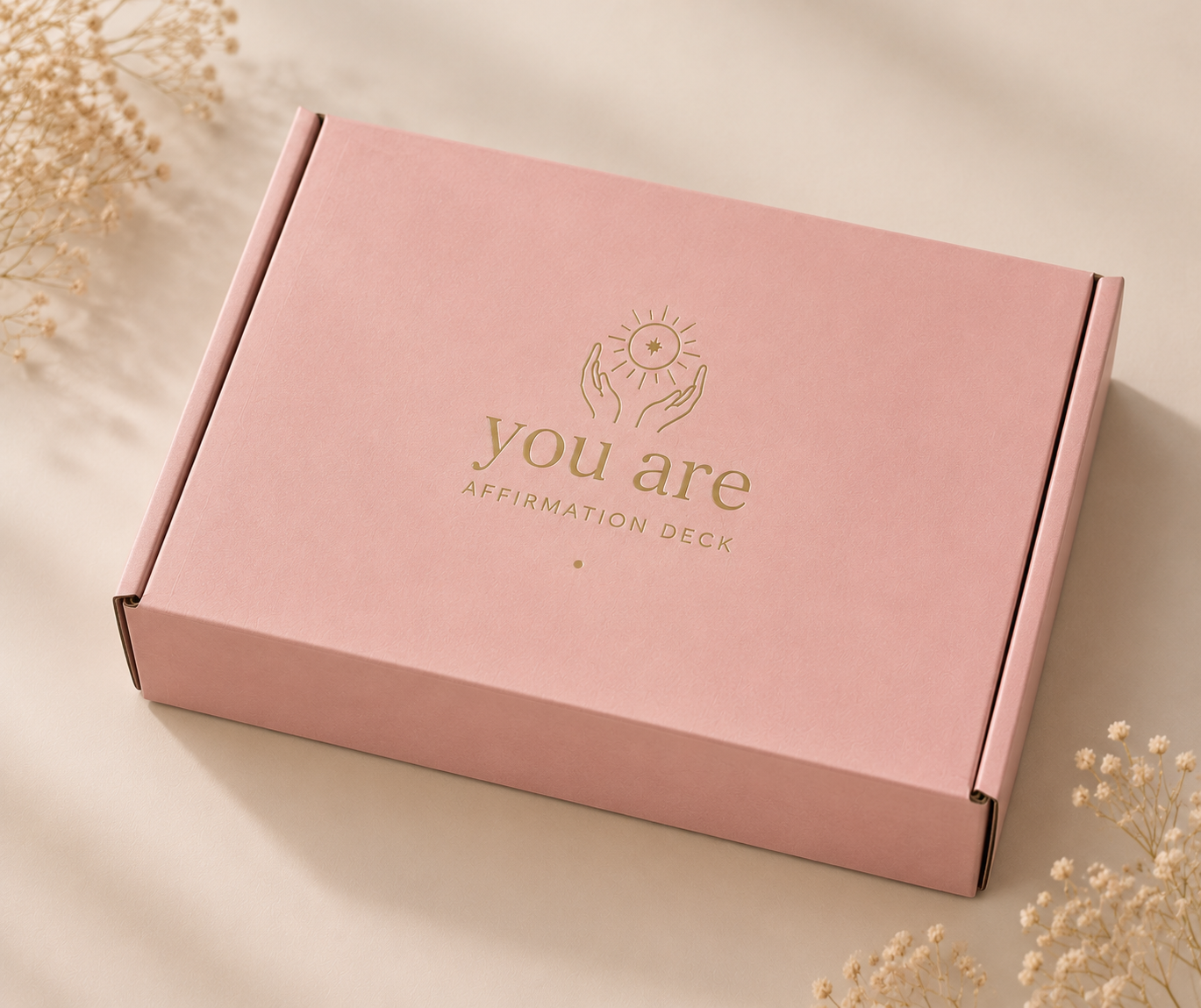 Blush gift box with a printed gold design